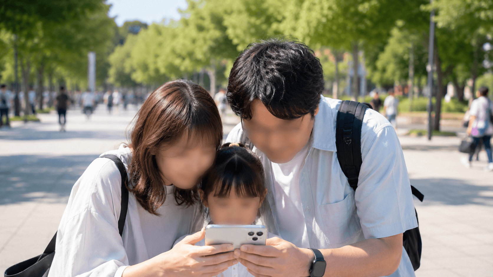 A family planning their day while checking a theme park's official app outdoors